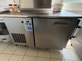 a stainless steel counter top in a commercial kitchen