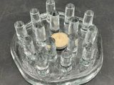 a tray with a lot of shot glasses on it