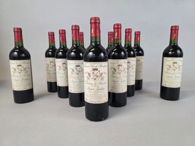 six bottles of wine are lined up on a table