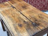 a wooden table that has two pieces of wood on top of it