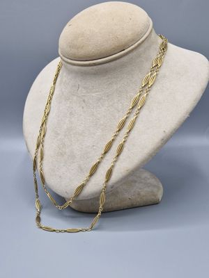 a close up of a mannequin with a necklace on it
