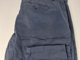 a pair of blue pants sitting on top of a white table