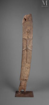 an image of a wooden sculpture of a man on a stand