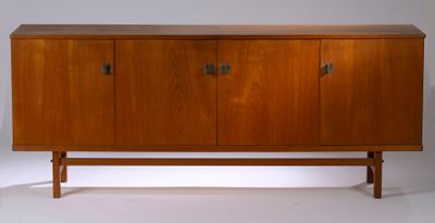 the sideboard is made of wood and has three doors