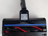 a close up of a vacuum cleaner with a cord attached to it