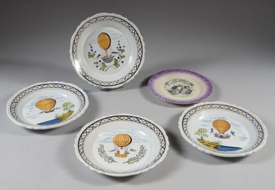 six plates with hot air balloons painted on them sitting on a table