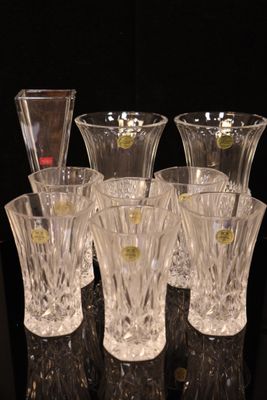 a lot of glasses that are sitting on a table