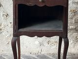 a small wooden table with a drawer on top of it