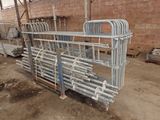 a large metal rack with a bunch of pipes attached to it