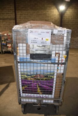 a cart with a bunch of boxes on it in a warehouse