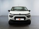 the front of a white citrole parked in a room