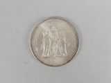 an image of a coin on a white surface