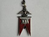 a close up of a red and white medal with a star on it