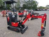 an image of a small excavator parked in a parking lot