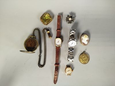many different types of watches and other items on the table