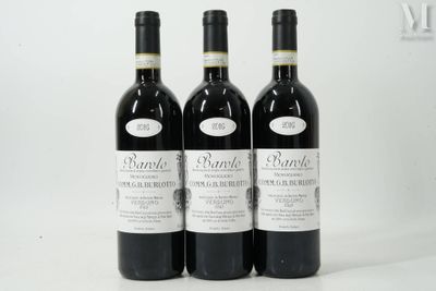 three bottles of wine sitting on top of a white table