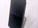 a cell phone that is sitting on top of a stand