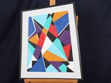 an image of a picture of a painting on a easel with a black background