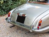 a silver car that is parked in the driveway