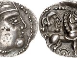 a silver coin with an image of a woman and a horse on it