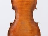 an antique violin with a wooden back and bow on a white background