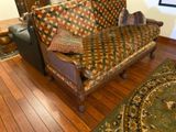 an image of a living room with a couch and a rug