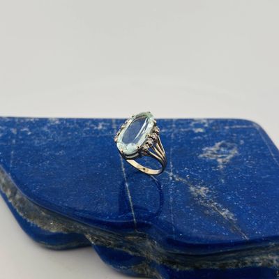 a close up of a blue stone with a ring on top of it