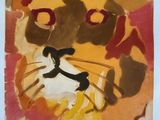une image représentant une peinture du visage d'un chat sur une feuille de papier