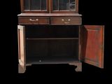 an old wooden cabinet with a glass door open