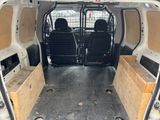 two seats in the back of a white van