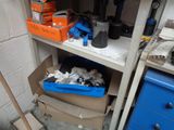a shelf with a bunch of boxes and tools on it
