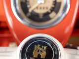 an image of a close up of a red motorcycle with a clock on it