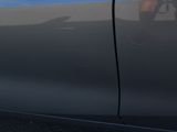 a person sitting in the passenger seat of a car