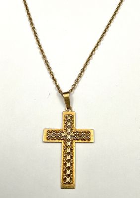 a gold cross pendant with a chain on a white background