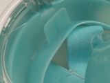 a close up of a toothbrush in a cup of water