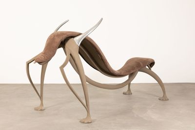 an image of a sculpture of a dog with horns on it