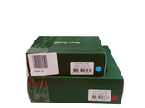 a green box with a white sticker and a red sticker on it