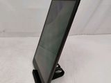 a tablet that is sitting on a stand on a table