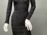 a mannequin wearing a black and white striped dress