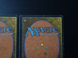 two decks of magic the gathering are shown on a table
