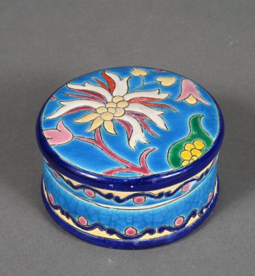 an image of a small blue box with a flower design on it