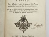 an open book with a picture of a coat of arms on it