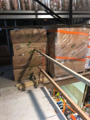 a pile of boxes sitting on a pallet in a warehouse