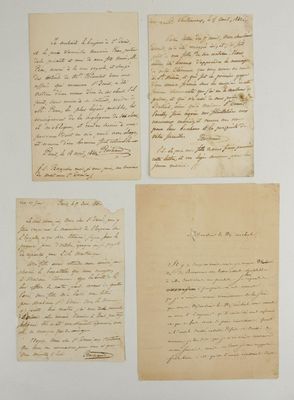 a group of four handwritten letters on paper with ink on them