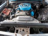 a blue engine in the back of a blue car