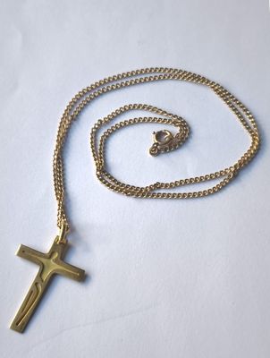 rosary and cross necklace on white background with gold chain