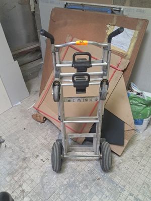 a hand truck that is sitting in the middle of a room