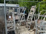 a lot of chairs that are sitting in the dirt