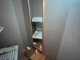 a bathroom with a sink and a mirror in it