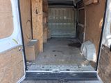 a white van that has a door open in the back